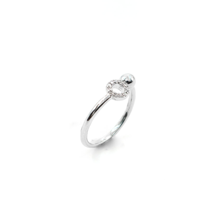 Anello contrarier con zirconi e pallina