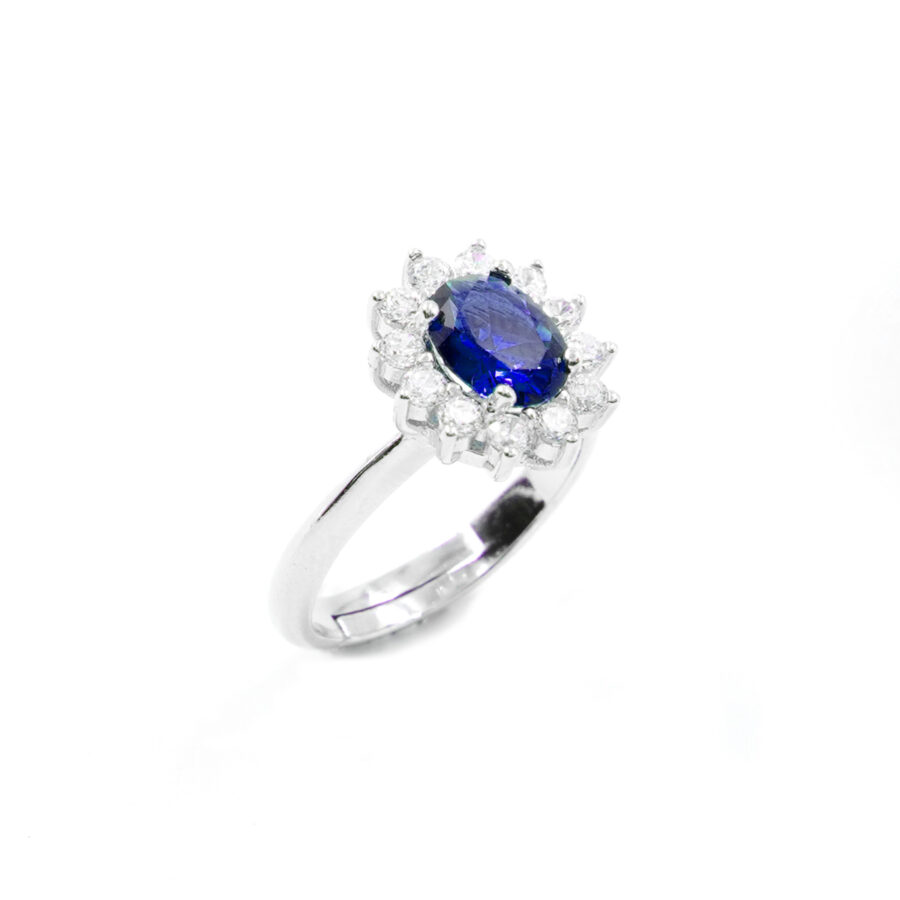 Anello in argento 925 con zircone ovale blu e giro di zirconi bianchi - Rodiato