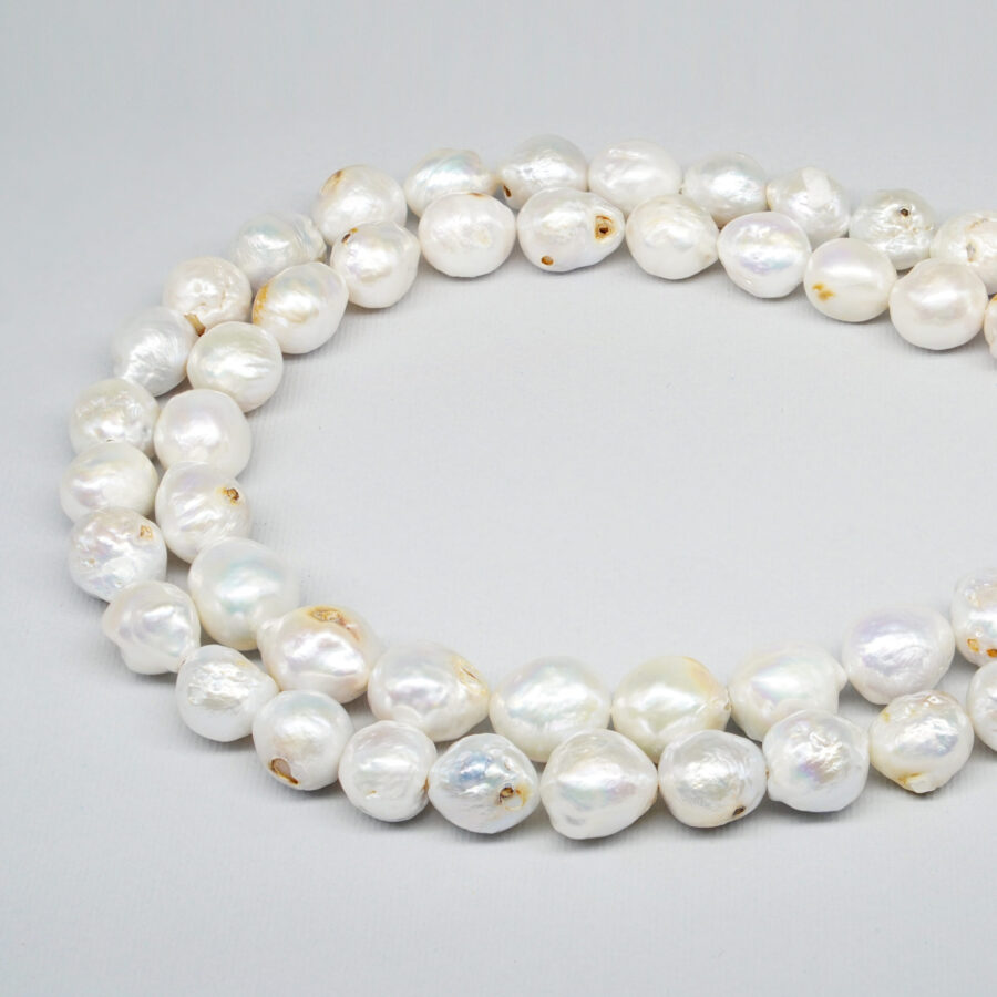 Perle d'Acqua Dolce fili barocco con nucleo 10-11mm