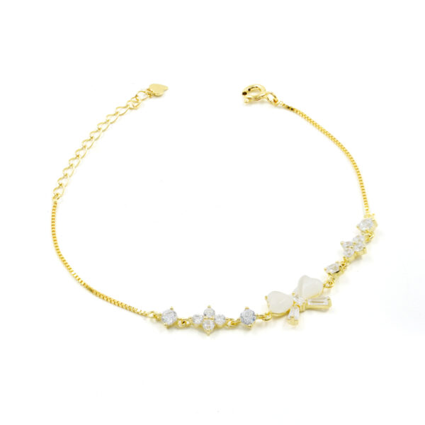 Bracciale in argento con fiocco e zirconi bianchi – Dorato